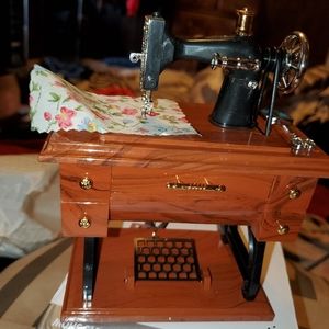 Vintage sewing machine music box.Moving parts